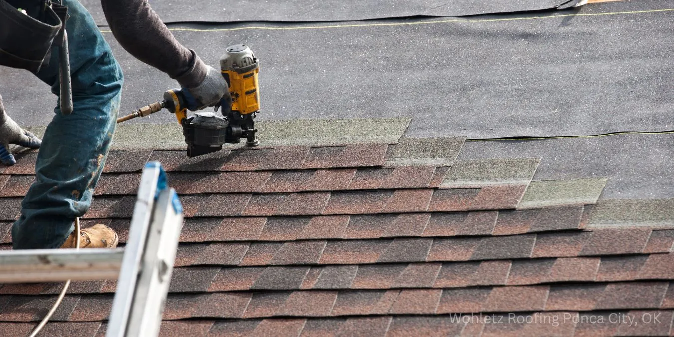 Wohletz roofing crew installing new asphalt shingles on a home in Ponca City, Oklahoma